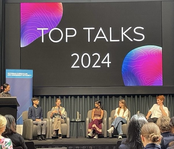 A group of students presenting at Top Talks 2024
