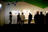 People browse in an exhibition space