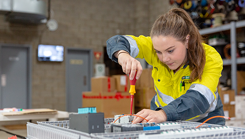 A female VET Electrical Industry student working